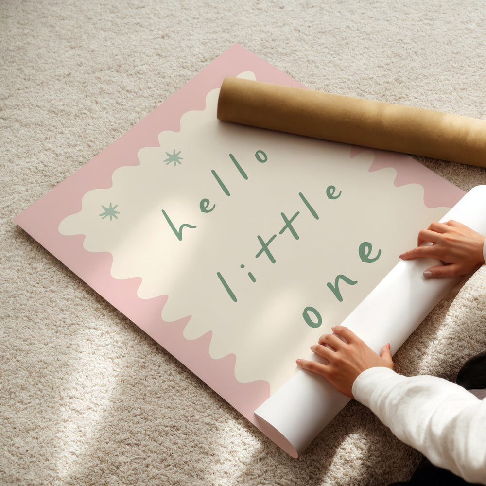 a person holding a rolled up sign on the floor