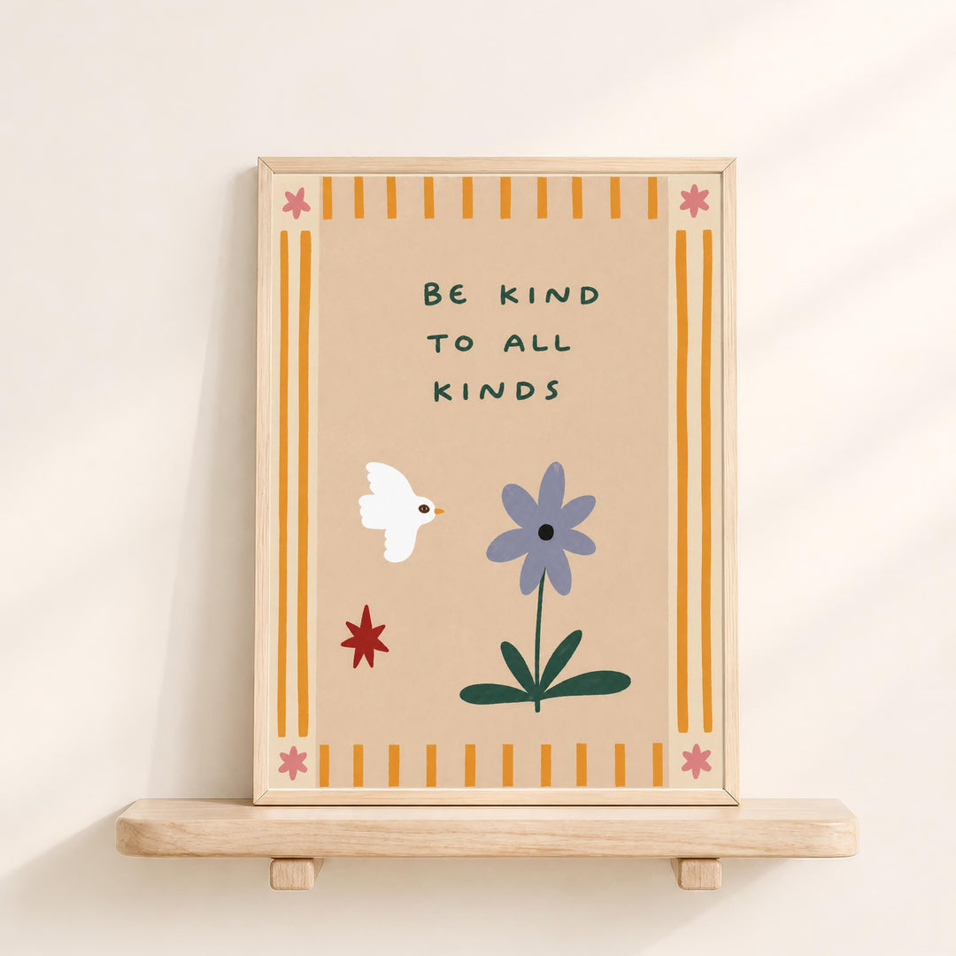 The image is a framed poster with a message encouraging kindness to all kinds. The poster features a white bird, a purple flower, and a red star, all set against a beige background with yellow and orange stripes.