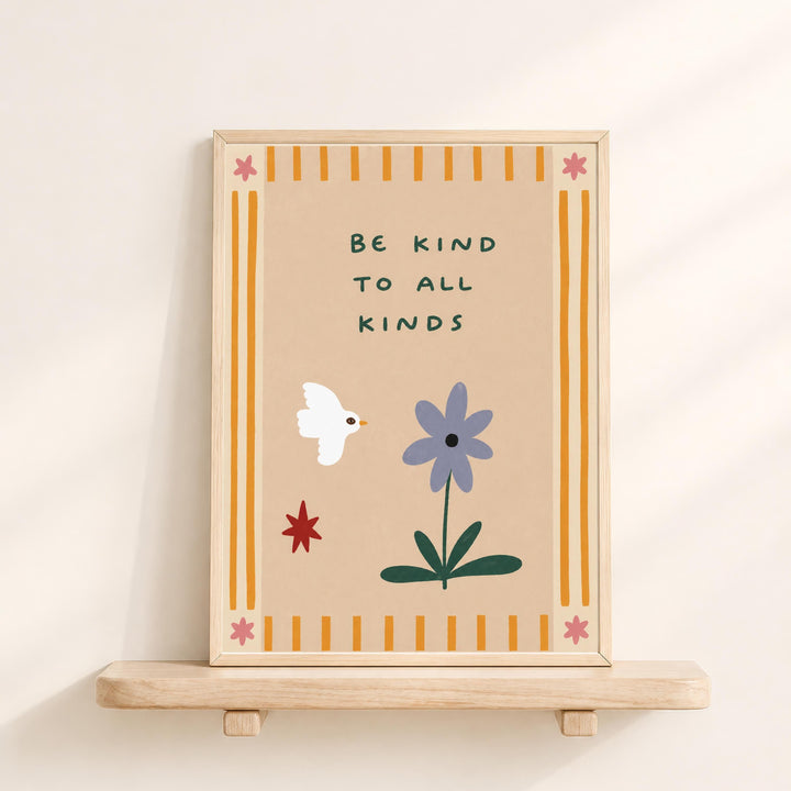The image is a framed poster with a message encouraging kindness to all kinds. The poster features a white bird, a purple flower, and a red star, all set against a beige background with yellow and orange stripes.