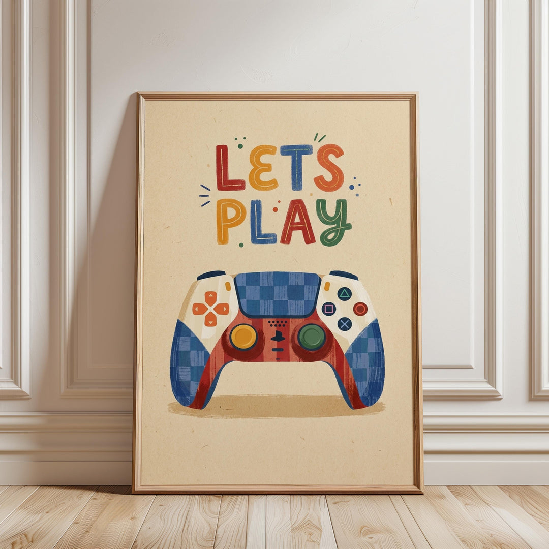 A framed poster with a colorful illustration of a game controller and the text "LET'S PLAY" on it.