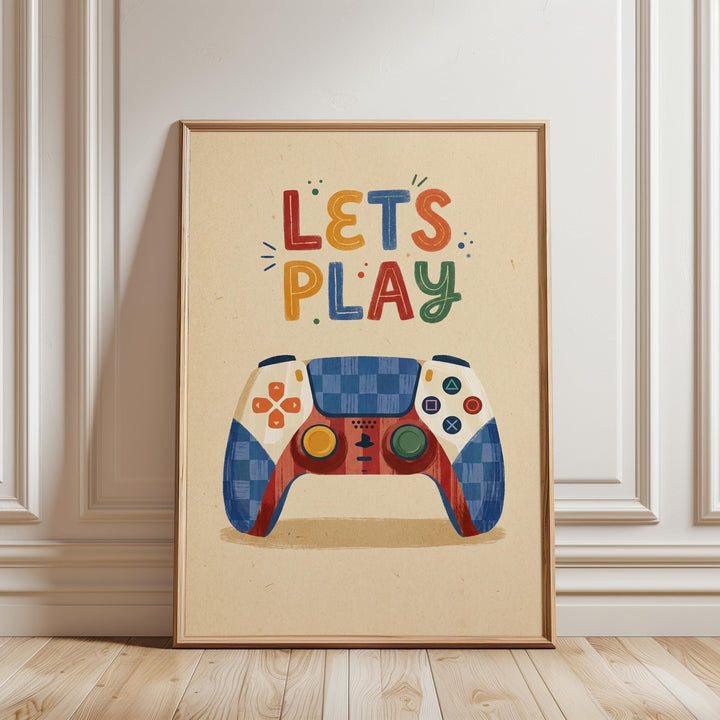 A framed poster with a colorful illustration of a game controller and the text "LET'S PLAY" on it.