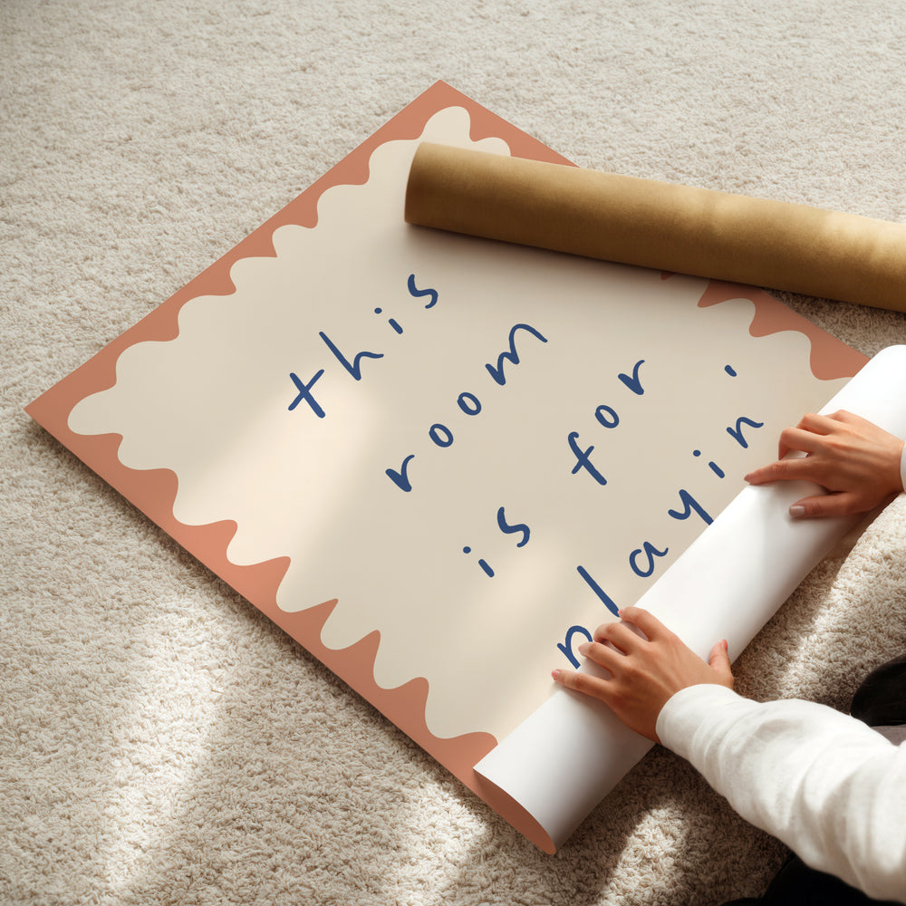 a child is holding a rolled up paper and a rolled up sign