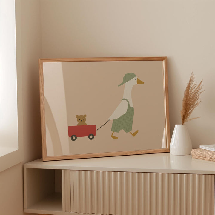 a picture of a duck pulling a bear on a red wagon