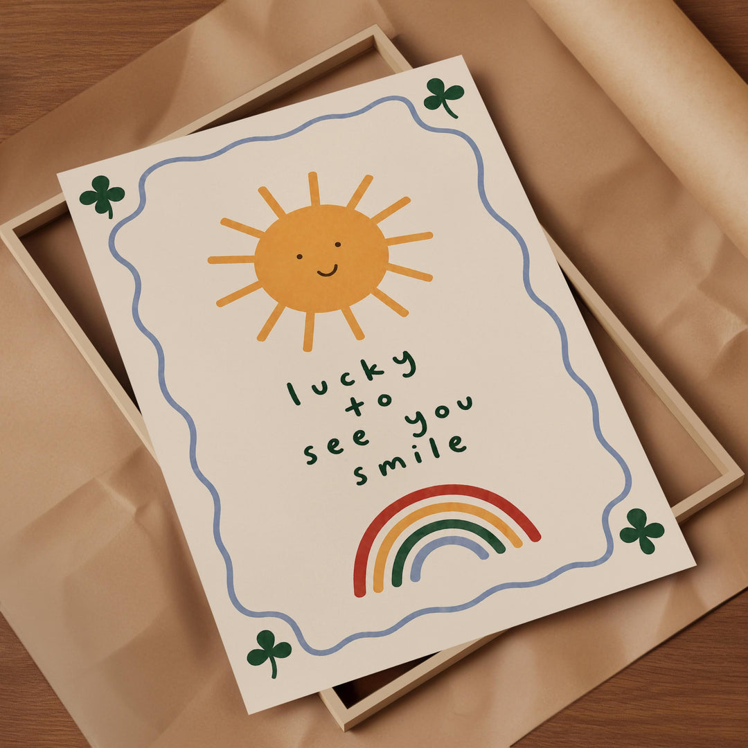 A greeting card with a sun, rainbow, and shamrocks, along with the text "lucky to see you smile".