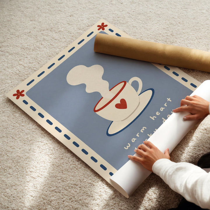 A person's hands are rolling up a poster with a blue background and a white coffee cup illustration.