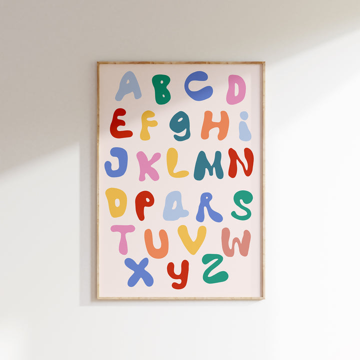 a picture of a colorful alphabet on a white wall