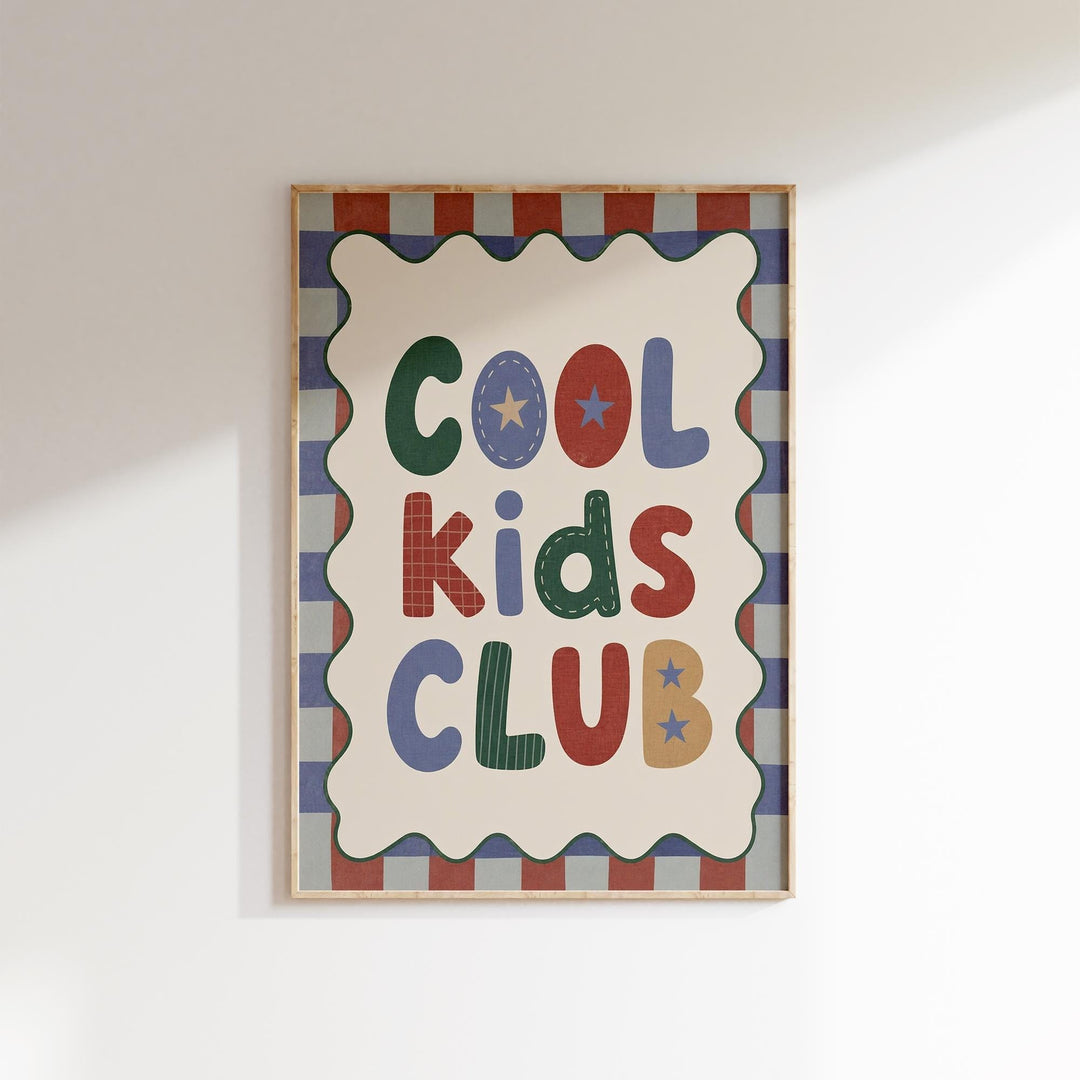 a framed poster with the text "Cool Kids Club" displayed prominently.