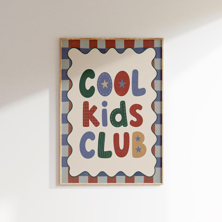 a framed poster with the text "Cool Kids Club" displayed prominently.