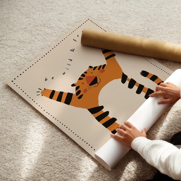 a child is holding a roll of paper with a picture of a tiger on it