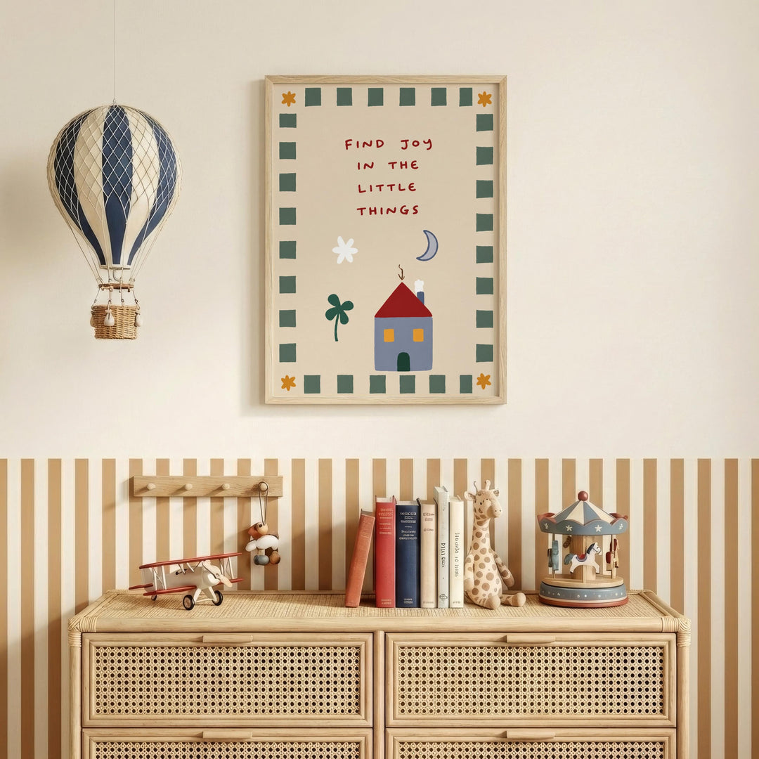 a children's bedroom with a wooden dresser, a toy airplane, a toy carousel, and a framed poster with a whimsical illustration and text.