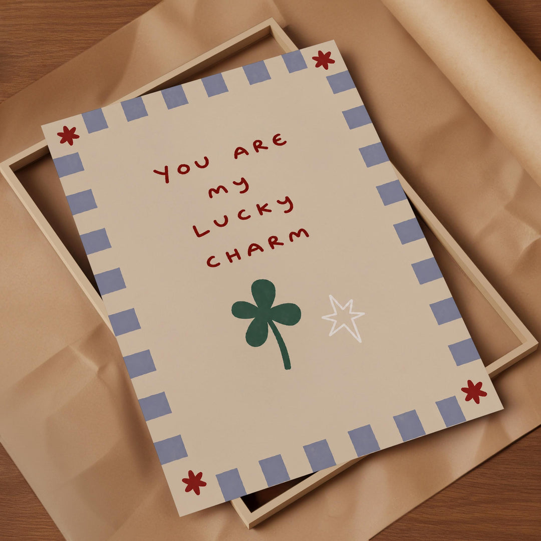 a card with a message that reads "You are my lucky charm" and includes a clover and a star.