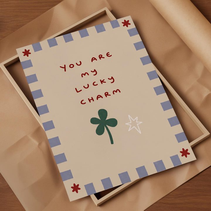 a card with a message that reads "You are my lucky charm" and includes a clover and a star.