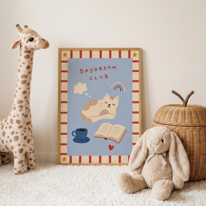 a poster with a giraffe, cat, and rabbit, along with a wicker basket and a stuffed rabbit, all arranged on a white carpet.