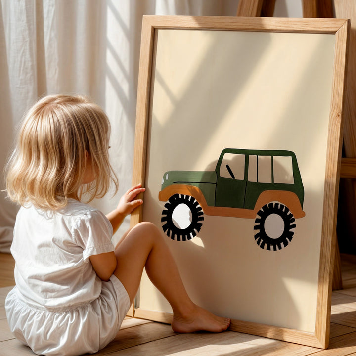 a little girl sitting on the floor next to a picture frame
