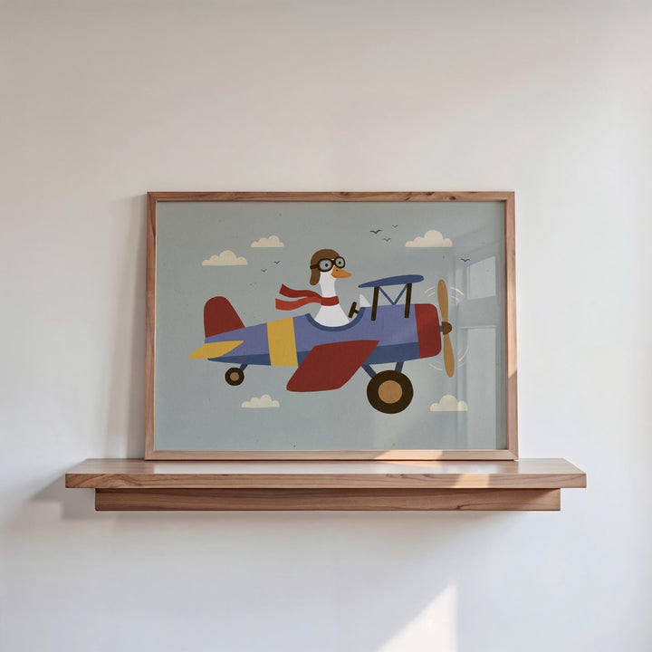 A framed illustration of a duck wearing a pilot's hat and flying a colorful airplane.