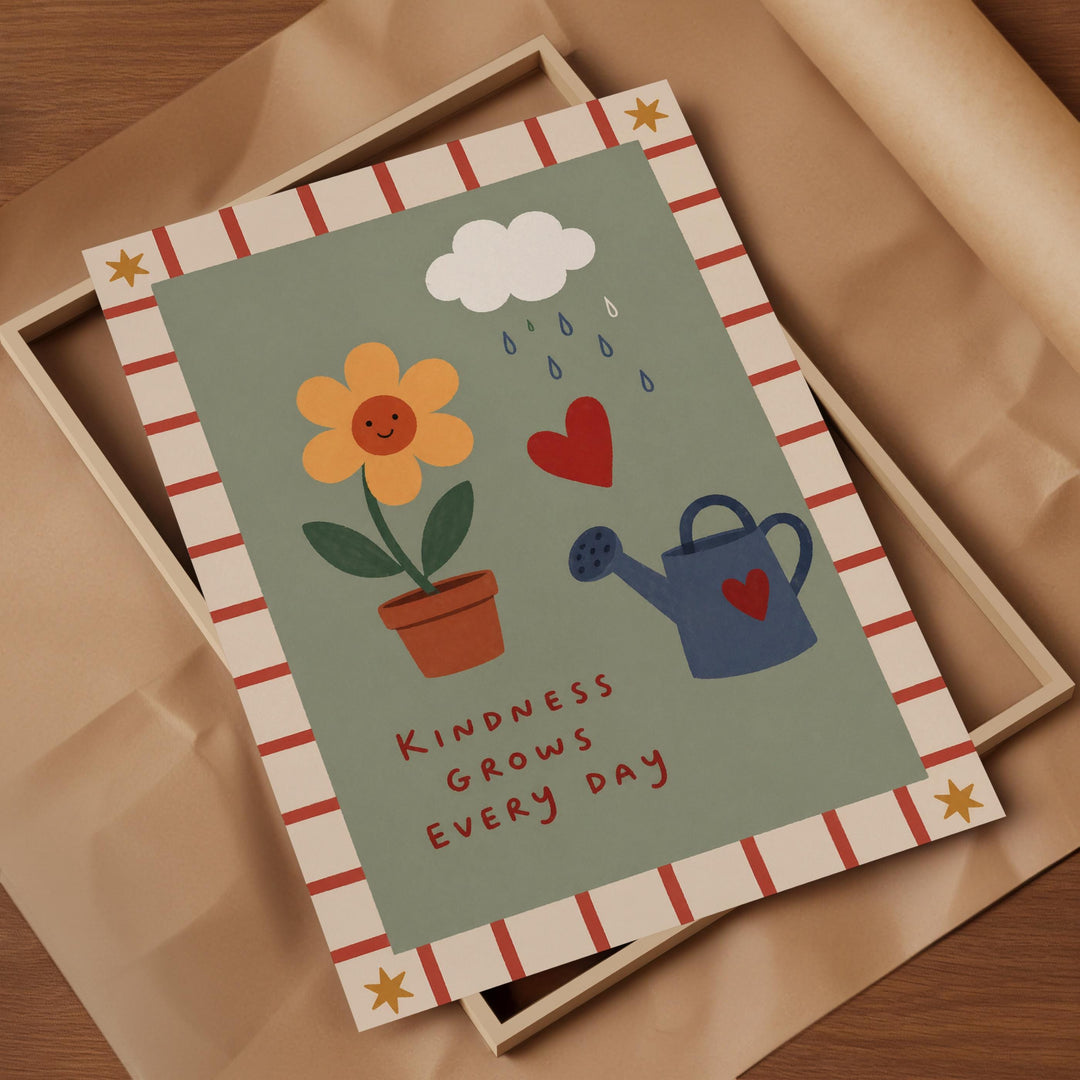 The image is a framed print with a green background, featuring illustrations of a flower, a watering can, and raindrops. The text "Kindness grows every day" is written below the illustrations.