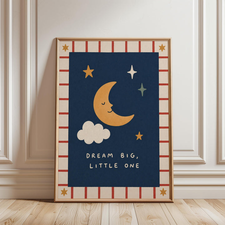 a framed poster with a moon and stars design, along with the text "DREAM BIG, LITTLE ONE" written below the moon.