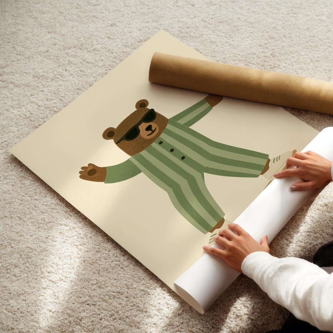a person holding a roll of paper with a picture of a bear on it