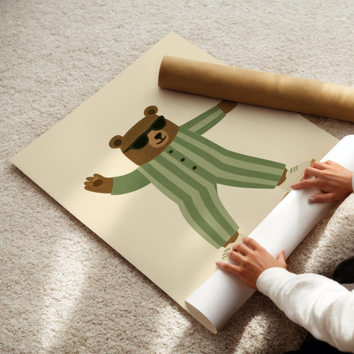 a person holding a roll of paper with a picture of a bear on it