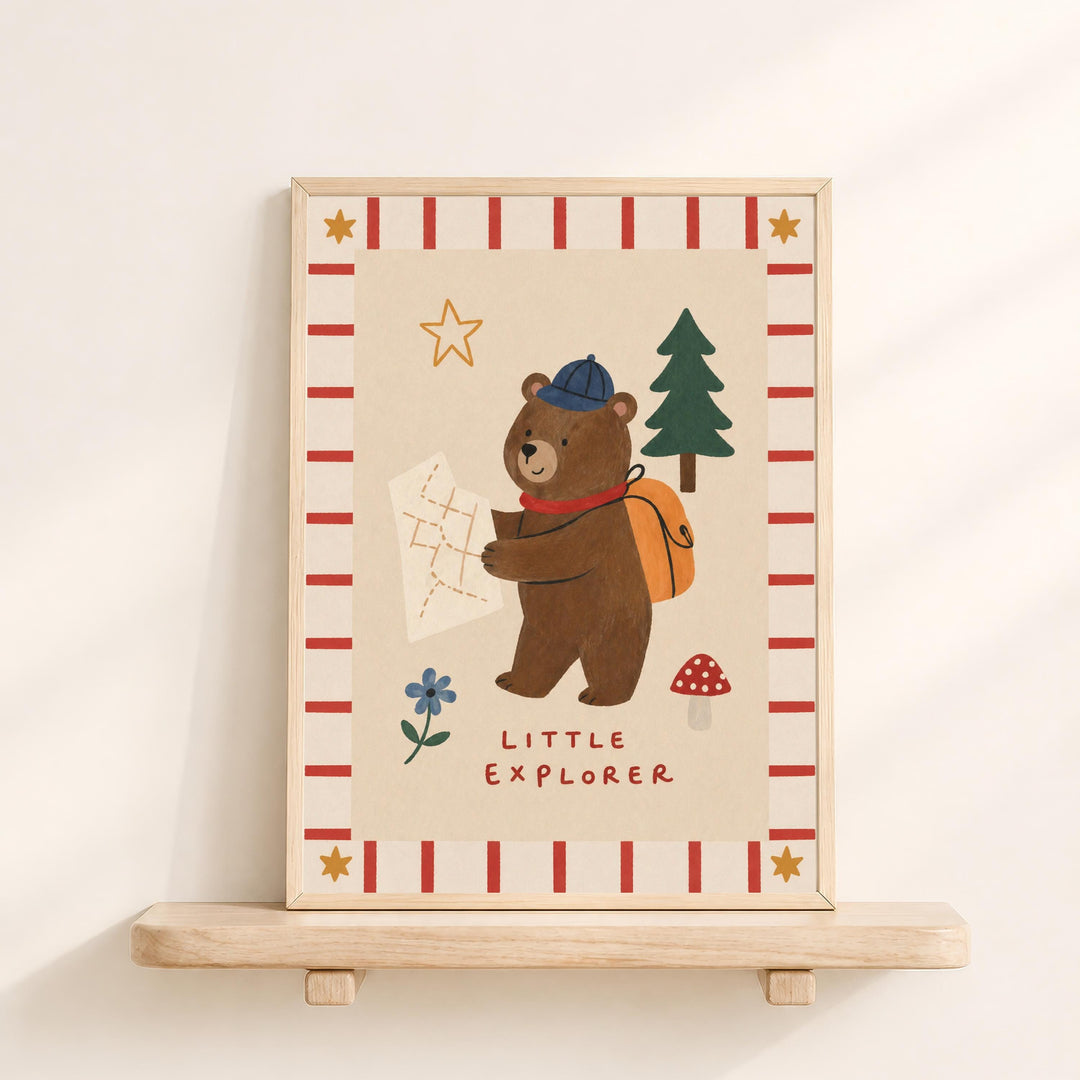 a bear holding a map and wearing a hat, with the text "Little Explorer" below the bear.