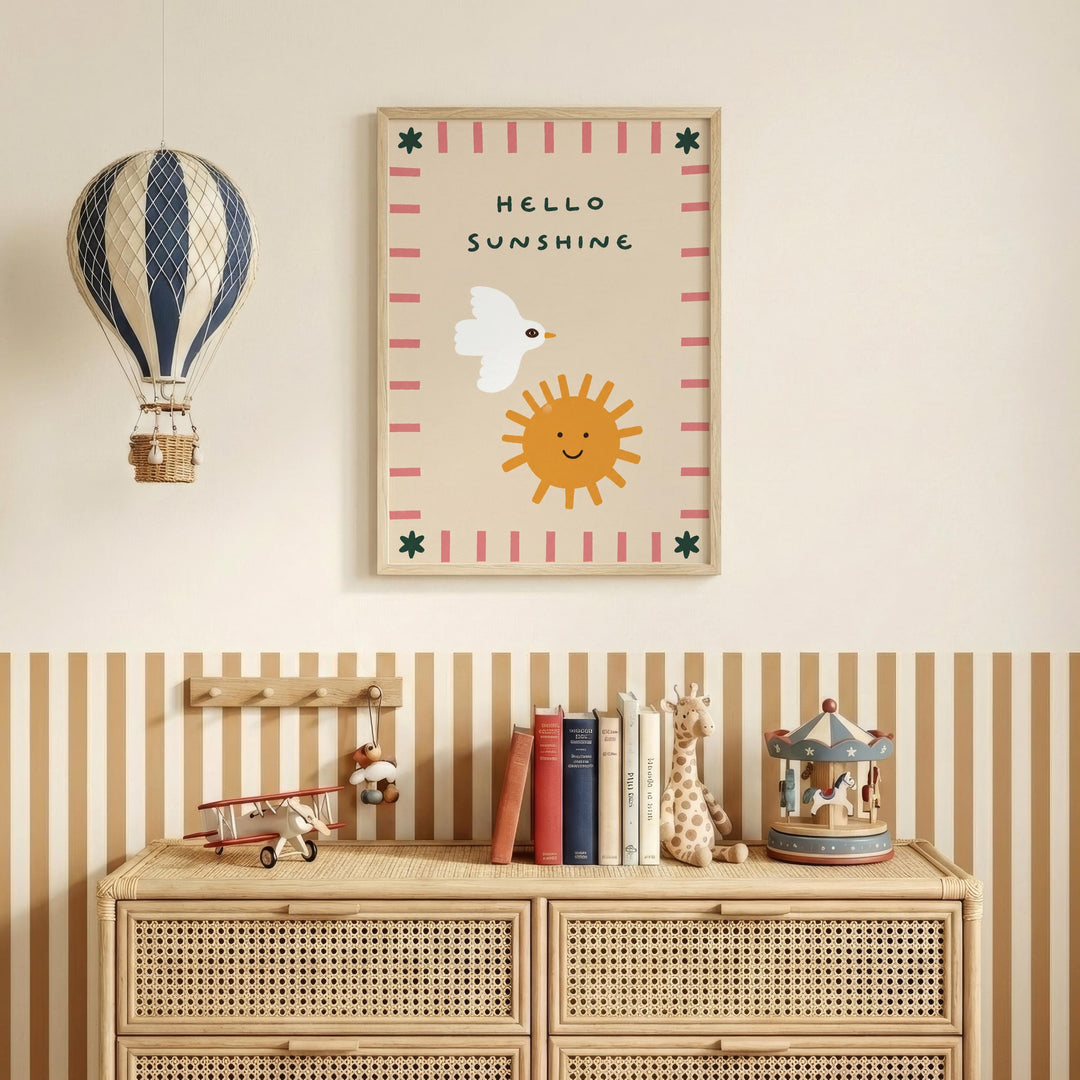 a children's bedroom with a wooden dresser, a toy airplane, a toy carousel, and a framed poster with a bird and a sun.