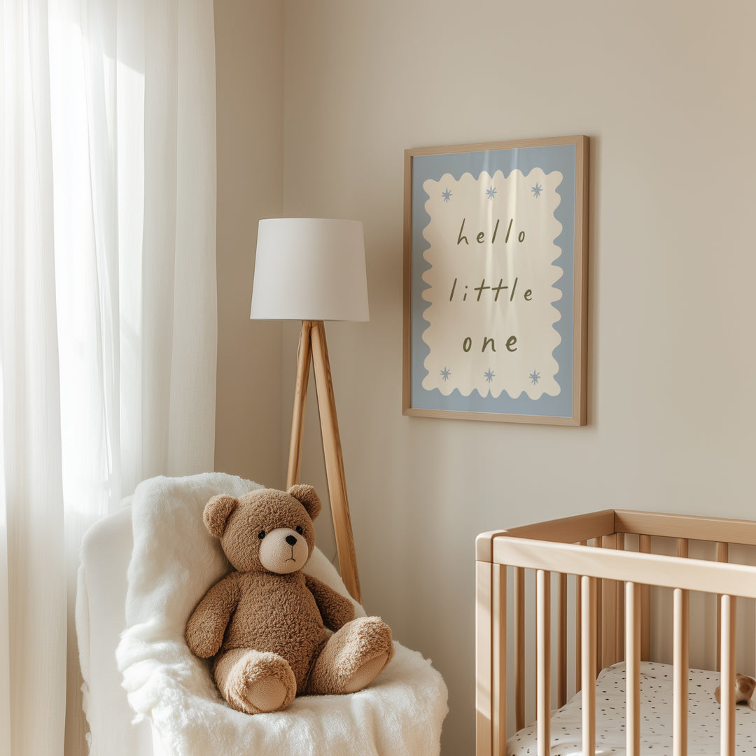 a teddy bear sitting in a chair next to a crib