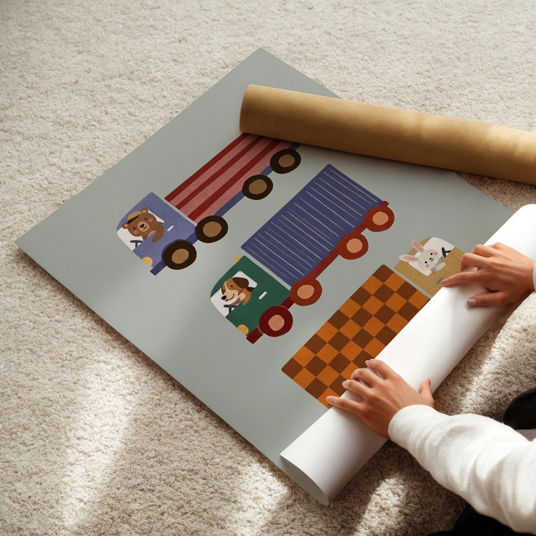 A child's hands are holding a roll of paper, which appears to be a poster or artwork featuring colorful illustrations of trucks and animals.