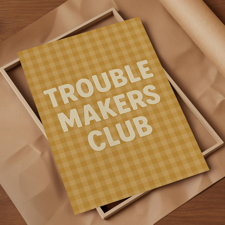 a brown paper with the words trouble makers club on it