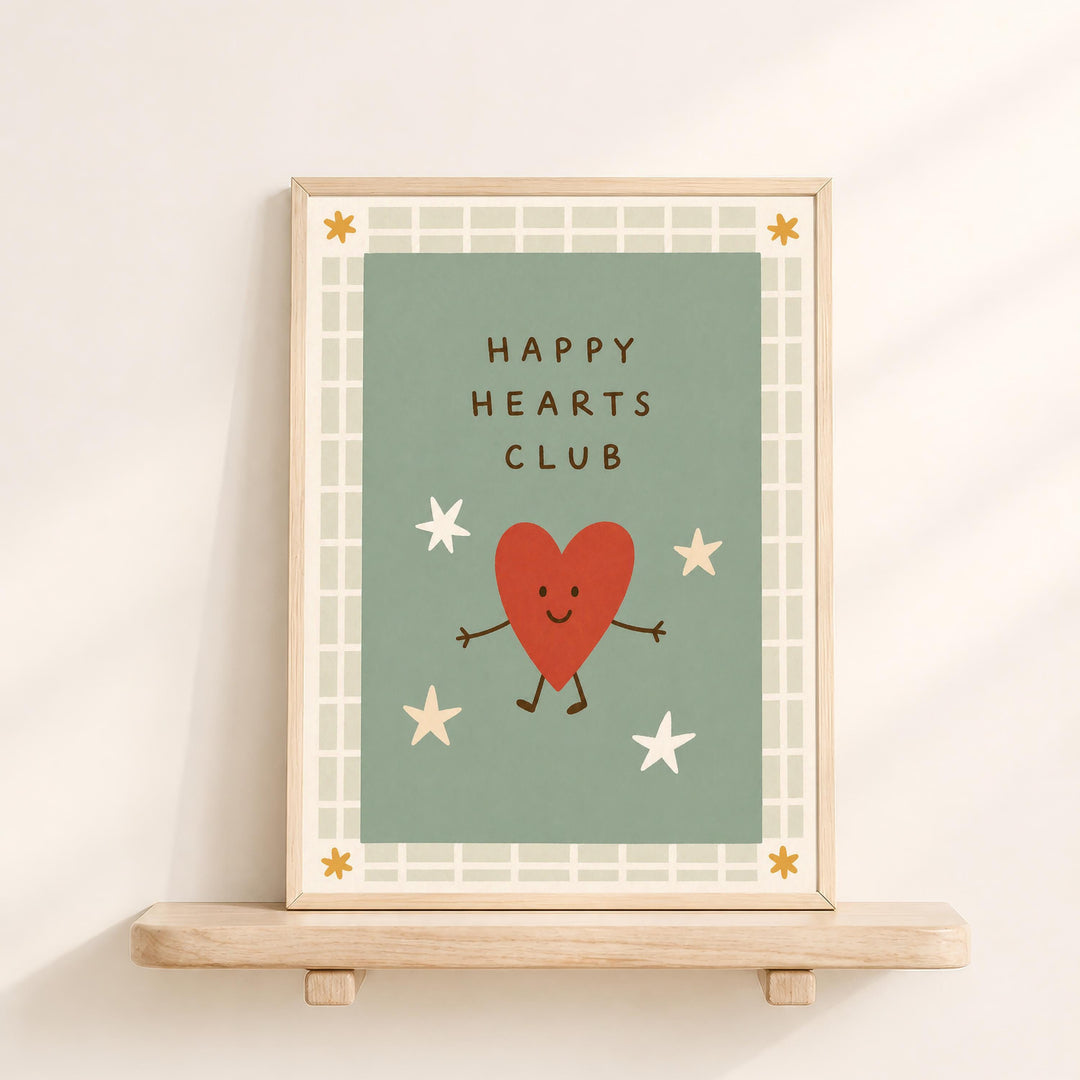 A framed illustration of a red heart character with arms and legs, surrounded by stars, with the text "HAPPY HEARTS CLUB" displayed on the frame.