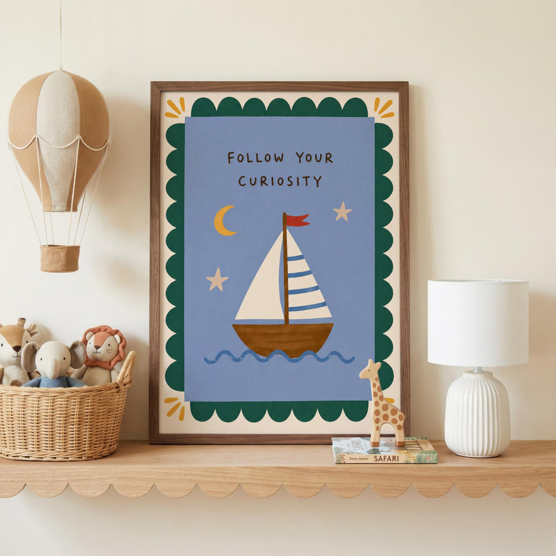 a framed picture of a sailboat on a blue background, with a motivational message "Follow Your Curiosity" written on it. The picture is displayed on a shelf, accompanied by a hot air balloon, a lamp, and a basket of stuffed animals.