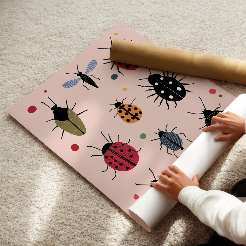 a child is rolling up a paper with ladybugs on it