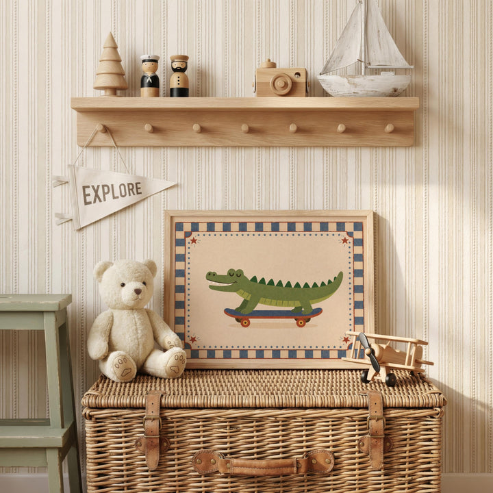 a wooden shelf with various toys and a framed picture of a crocodile on a skateboard, a white teddy bear, and a small wooden airplane.