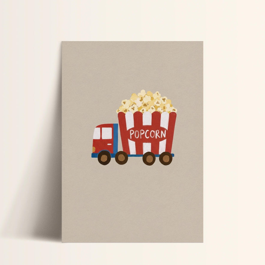 A red and white truck with a large red and white striped bucket filled with popcorn.