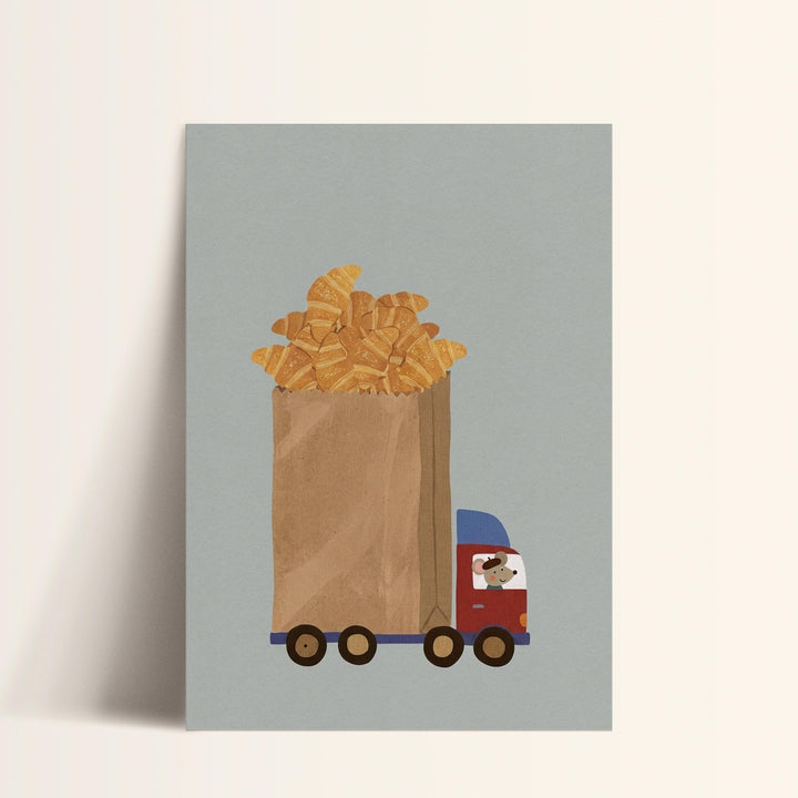 A cartoon image of a truck carrying a large bag filled with golden-brown croissants.