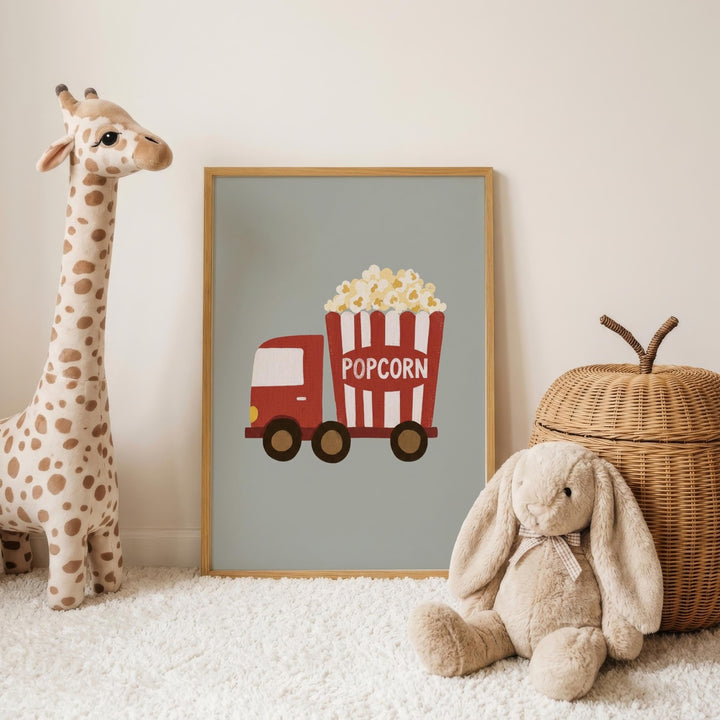 a giraffe, a stuffed rabbit, and a wicker basket, all placed on a white carpet. In the background, there is a framed picture of a red and white truck with a red and white striped bucket labeled "POPCORN".