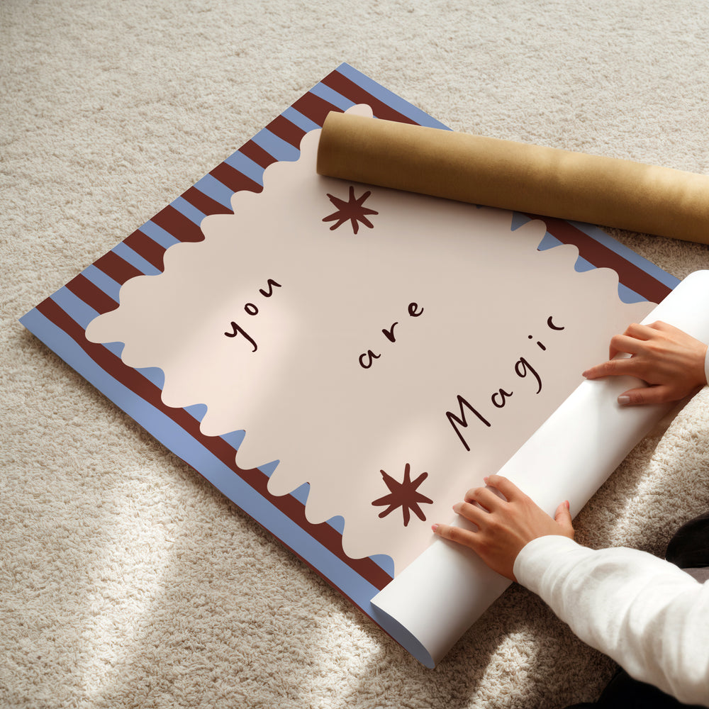 a child is holding a roll of paper with a message on it