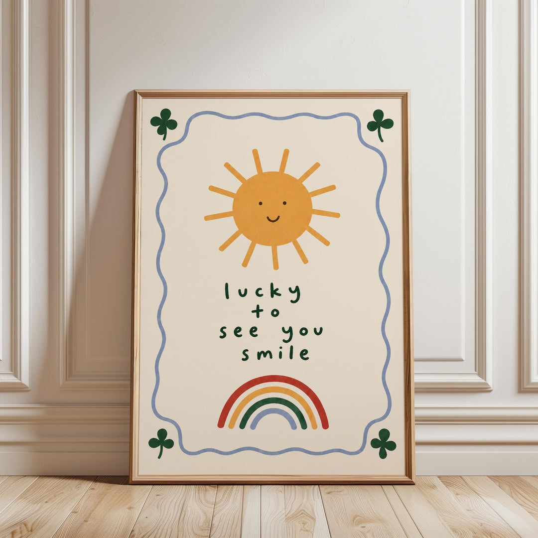 A framed poster with a cheerful sun and rainbow, along with the text "lucky to see you smile".