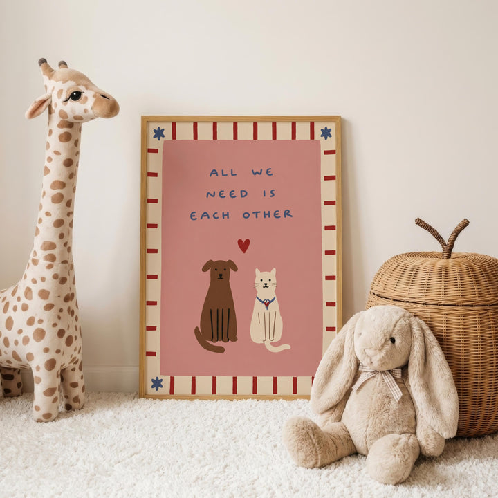 a pink poster with a message about the importance of each other, accompanied by a stuffed dog and cat, and a stuffed rabbit.