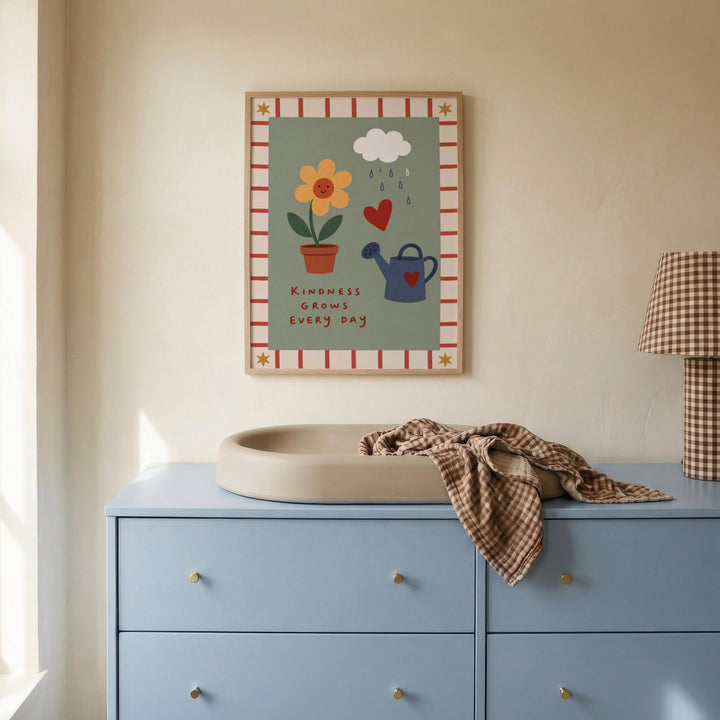 a blue dresser with a white sink on top, and a framed poster with a flower, heart, and watering can on the wall above it.
