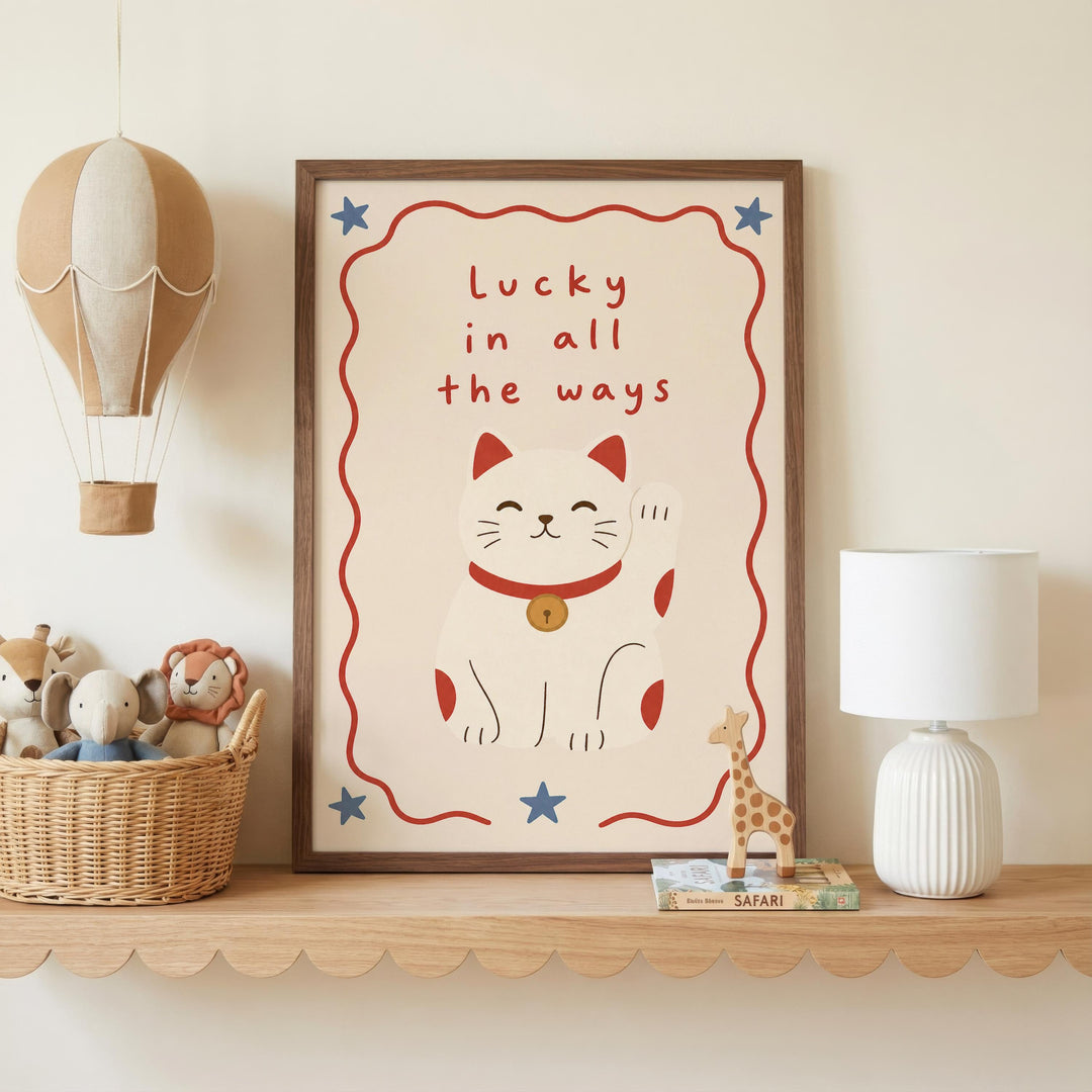 a framed poster with a cat illustration, a hot air balloon, and a lamp on a shelf.