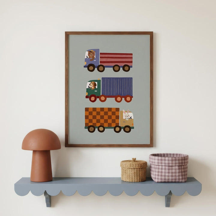 a shelf with a framed picture of three colorful trucks, a brown mushroom-shaped lamp, and a woven basket.
