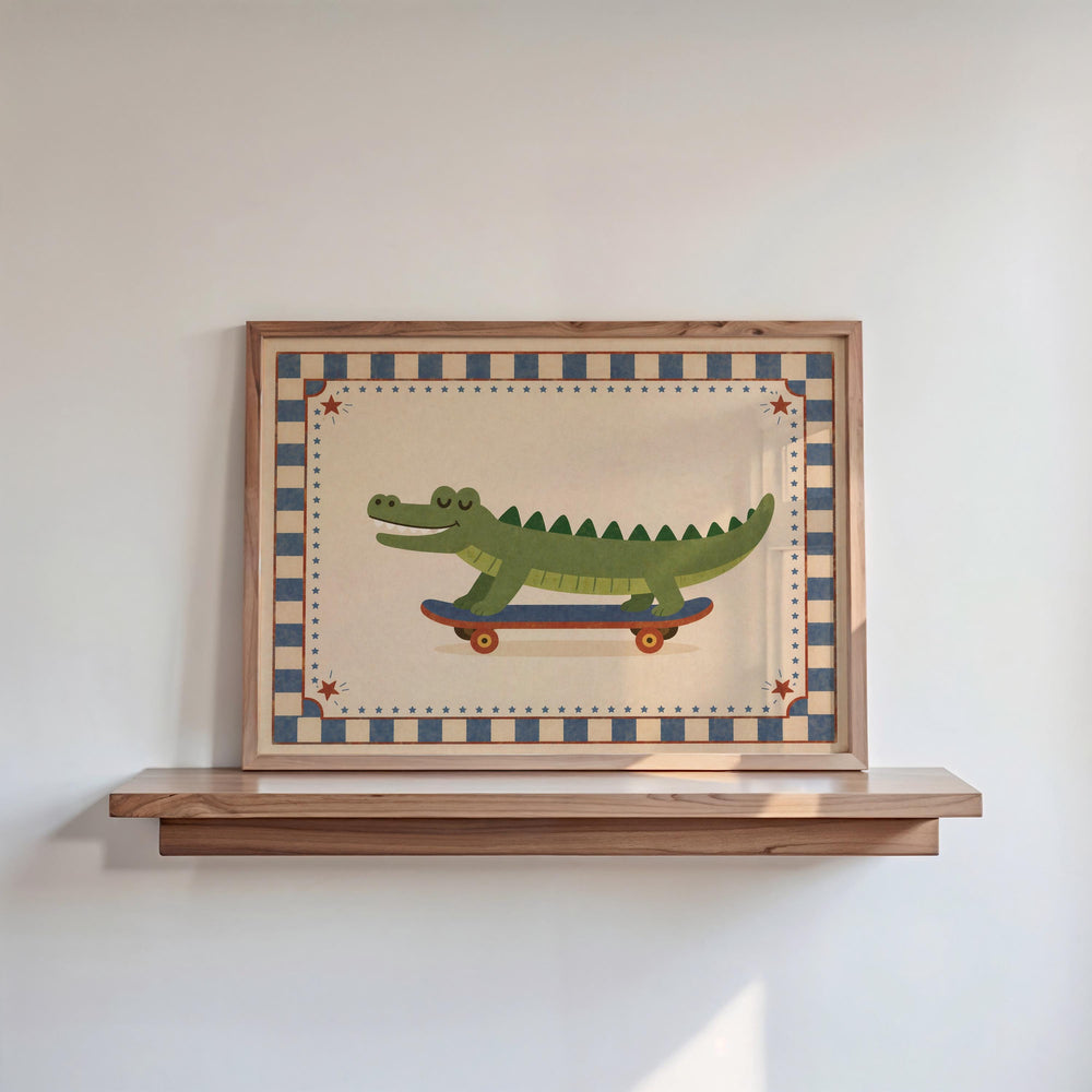 A framed painting of a green alligator riding a skateboard is displayed on a wooden shelf against a white wall.
