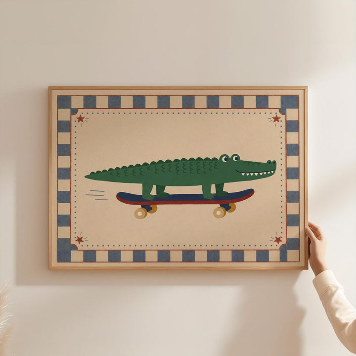 A person is holding a framed picture of a green alligator riding a skateboard.