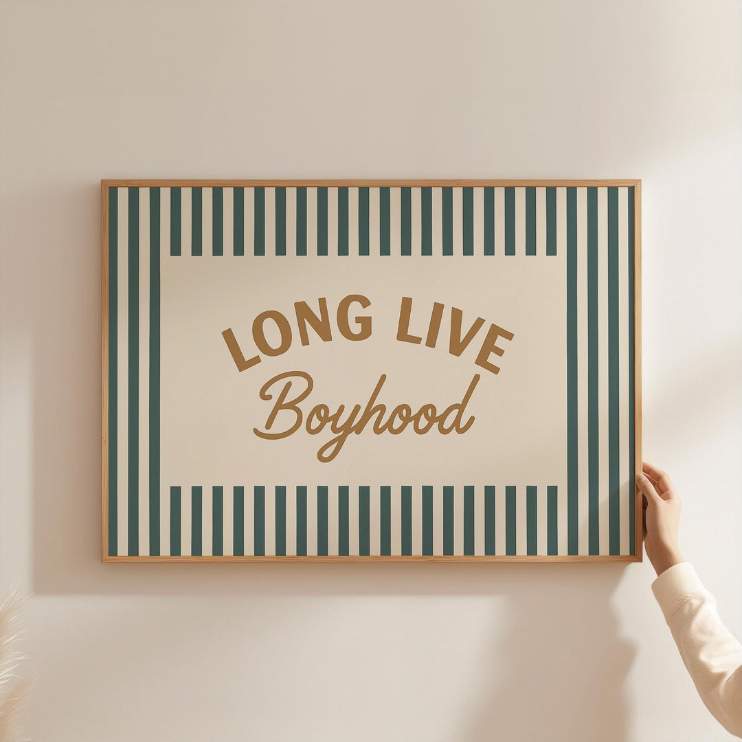 a person holding up a sign that says long live boyhood