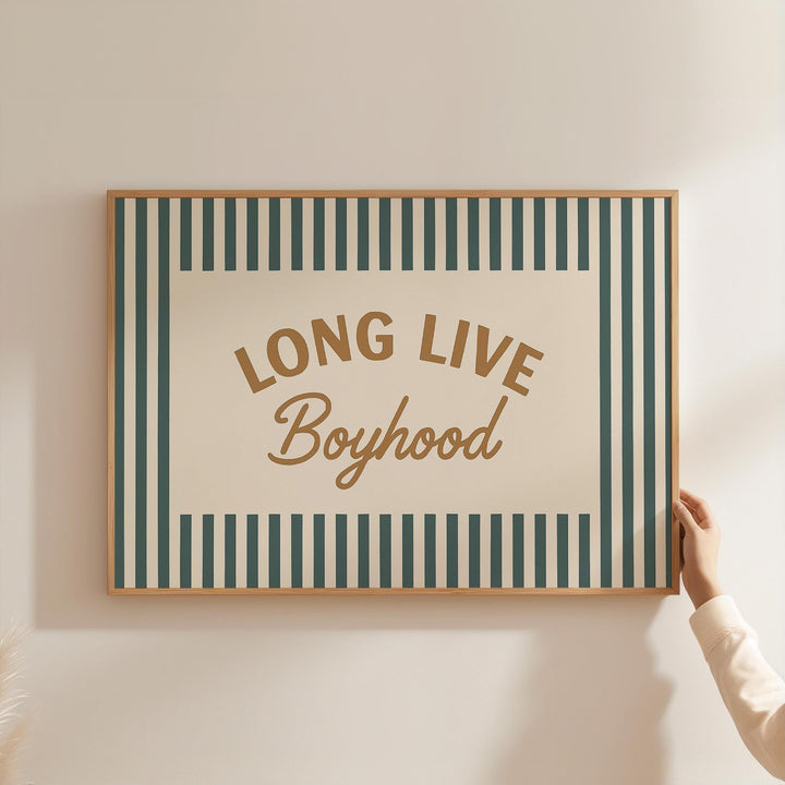 a person holding up a sign that says long live boyhood