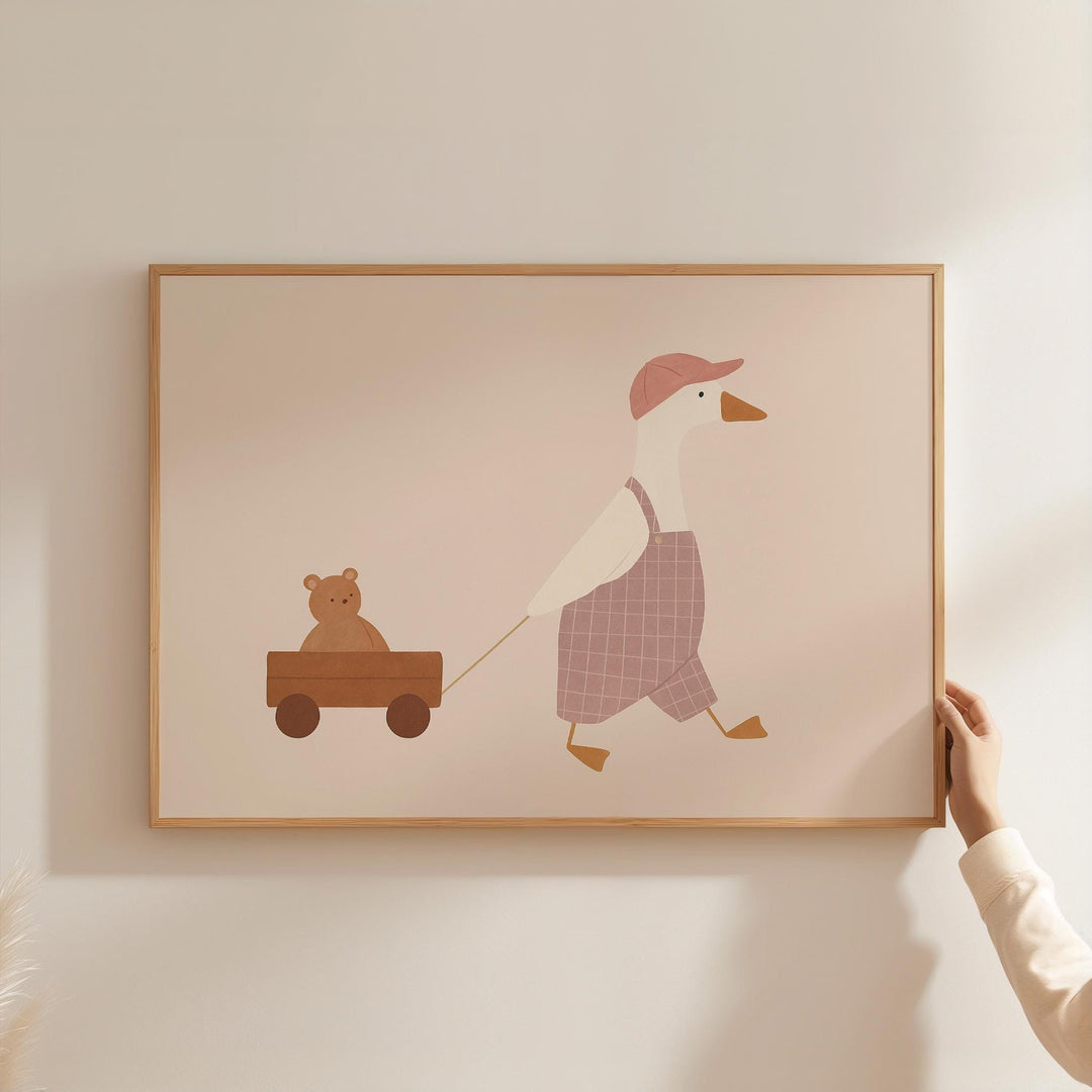 a person holding a picture of a duck and a bear