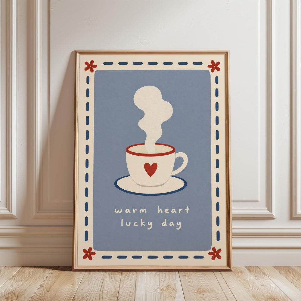 A framed poster with a blue background and a white coffee cup with a red heart on it, along with the text "Warm heart lucky day".