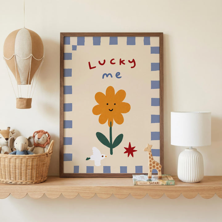 a shelf with a framed picture of a flower, a hot air balloon, and various toys, including stuffed animals and a giraffe.
