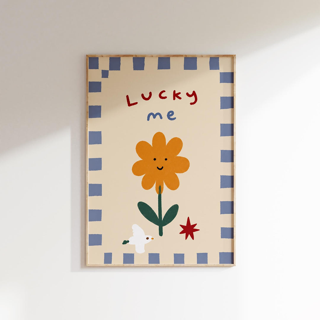 The image is a framed artwork featuring a cheerful flower with a smiling face, surrounded by a blue and white checkered border.