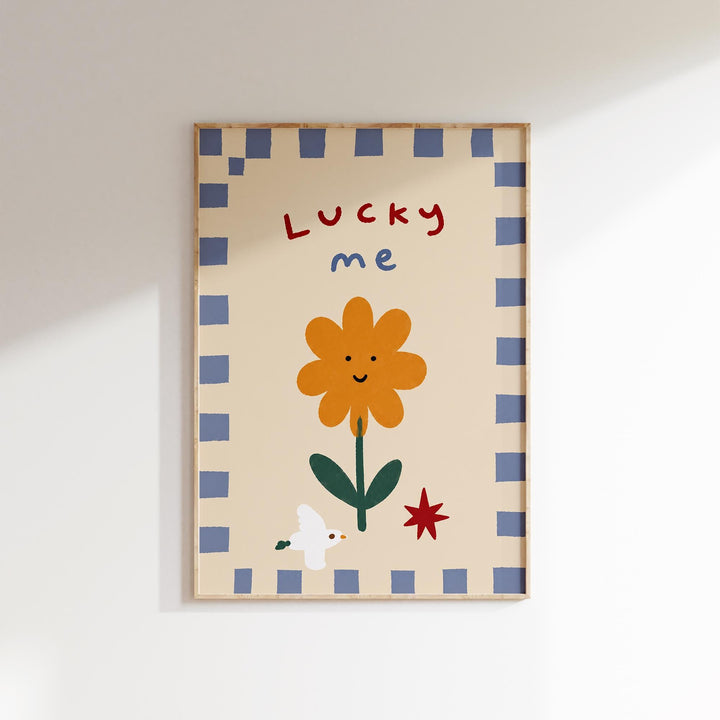 The image is a framed artwork featuring a cheerful flower with a smiling face, surrounded by a blue and white checkered border.